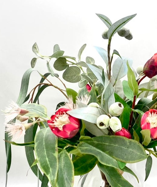 The Grand Protea Collection: Fresh and Colourful Arrangement with Drooping Gum Leaves and Vibrant Red Baby Proteas